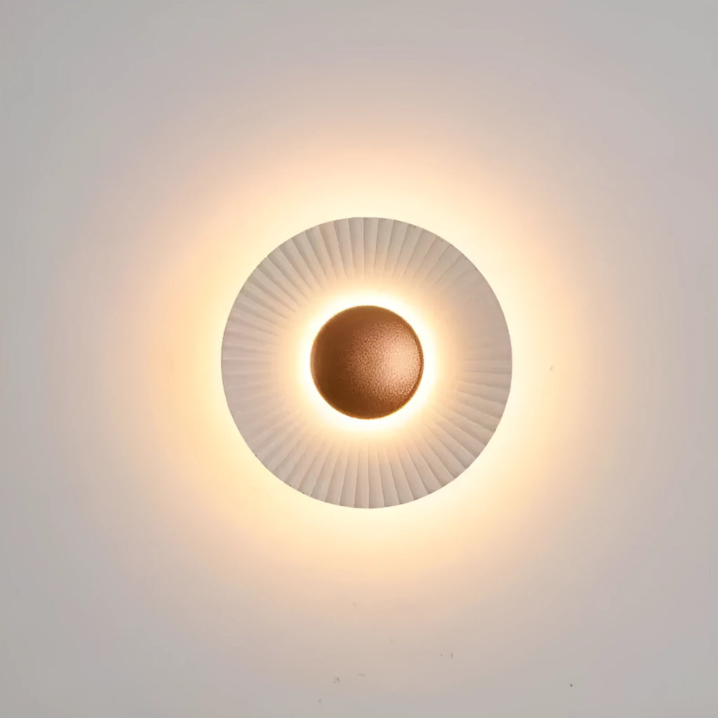 Round aluminium LED wall lamp in a dual-colour finish mounted on a wall.