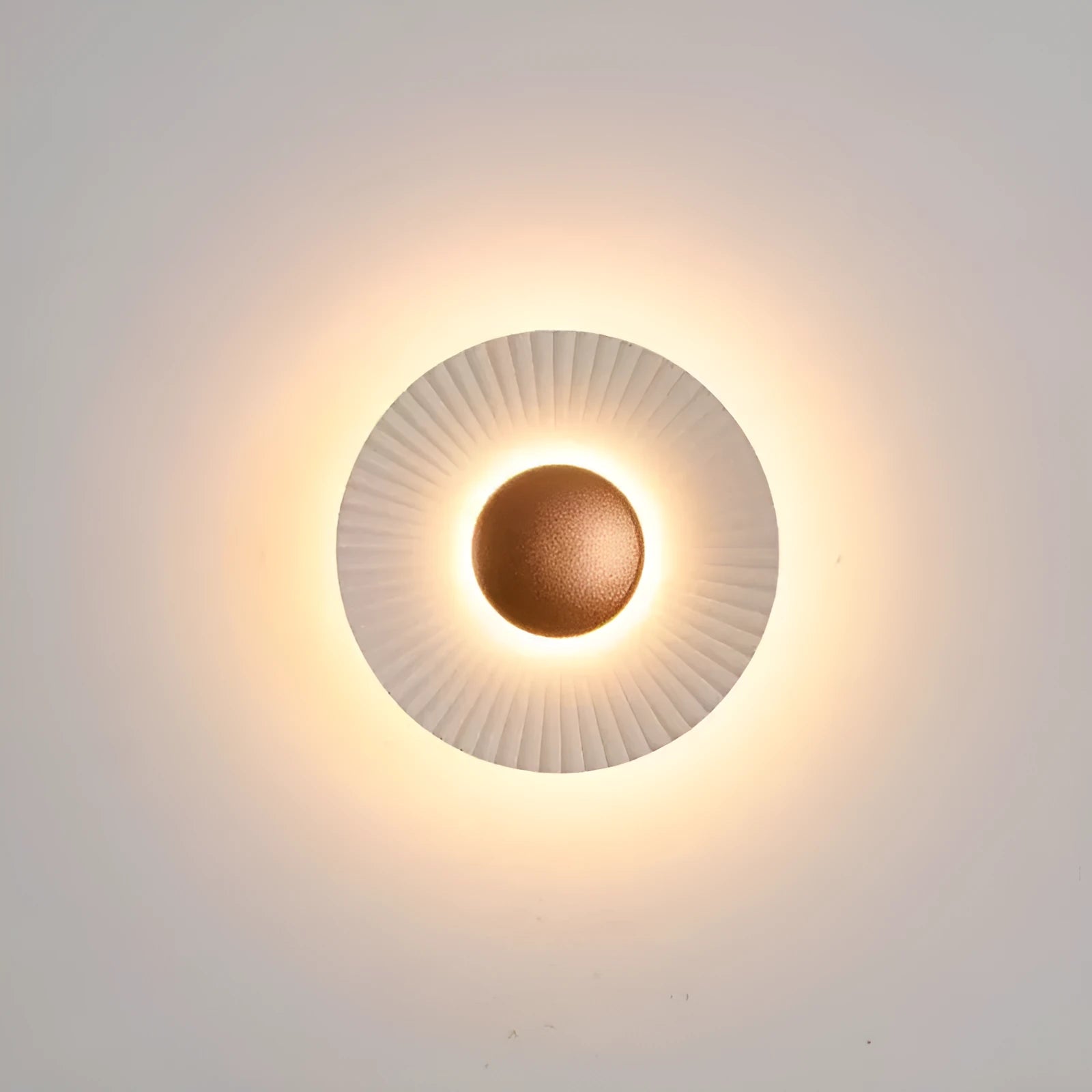 Round aluminium LED wall lamp in a dual-colour finish mounted on a wall.