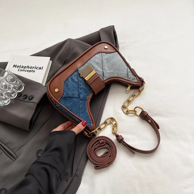 Women's brown denim shoulder bag with diamond chain accents and bucket shape design