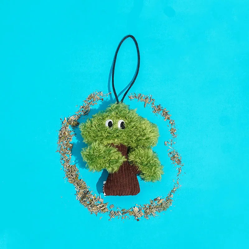 Green pine tree shaped cat toy with hanging loop for biting and interactive play
