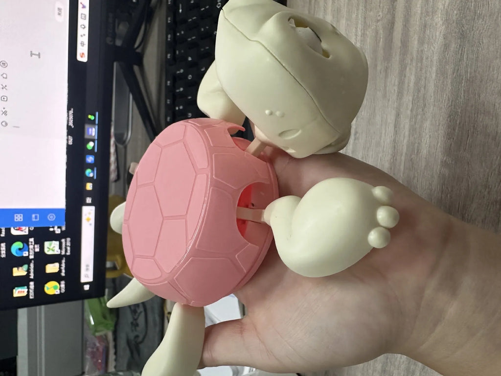 Turtle-shaped ABS plastic coaster in light green colour for heat insulation