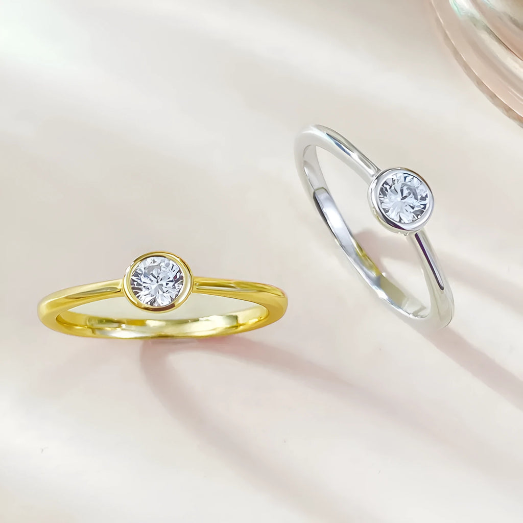 Minimalist silver crown-shaped ring with linear detailing and electroplated finish