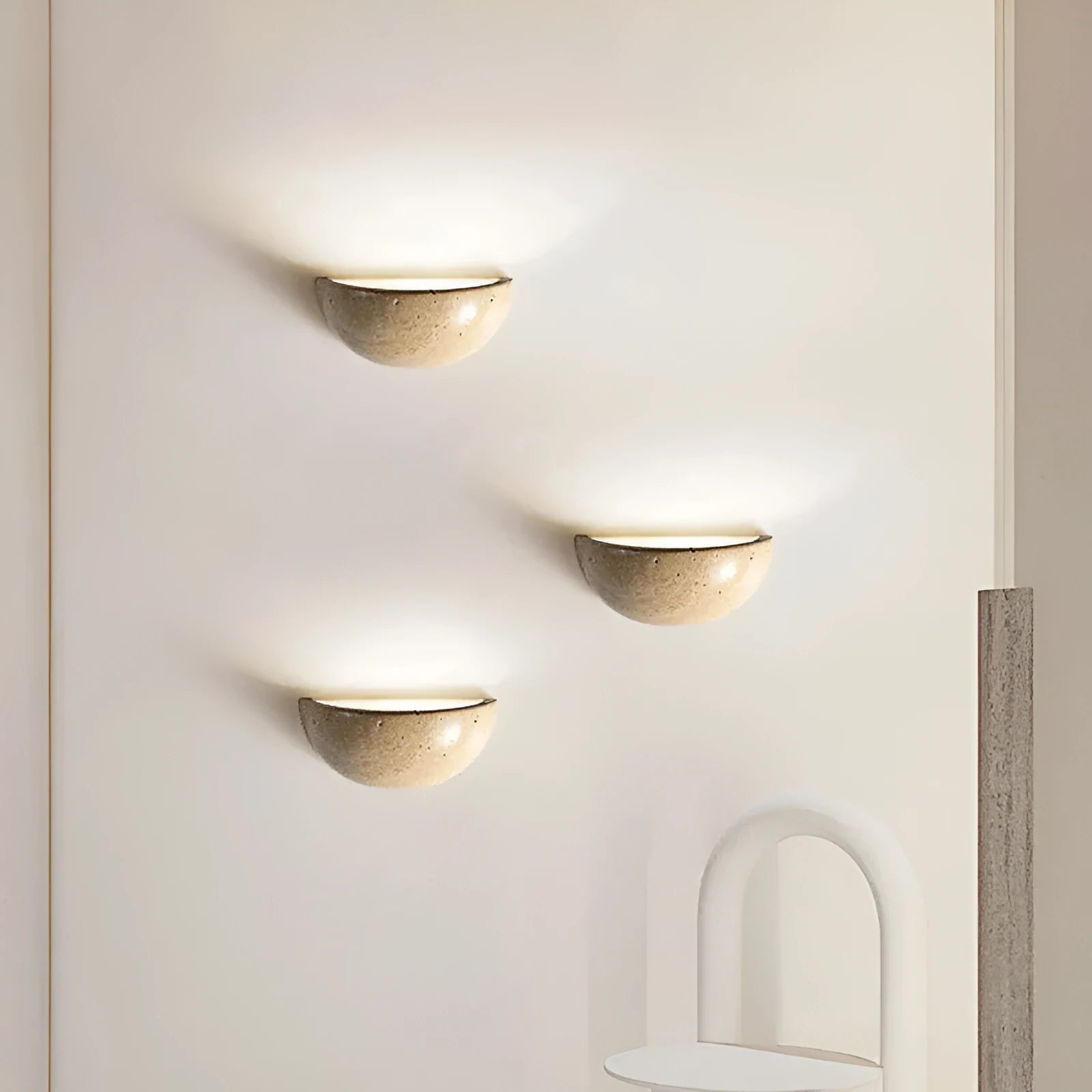 Retro marble semicircle wall lamp with adjustable LED light on a stone wall