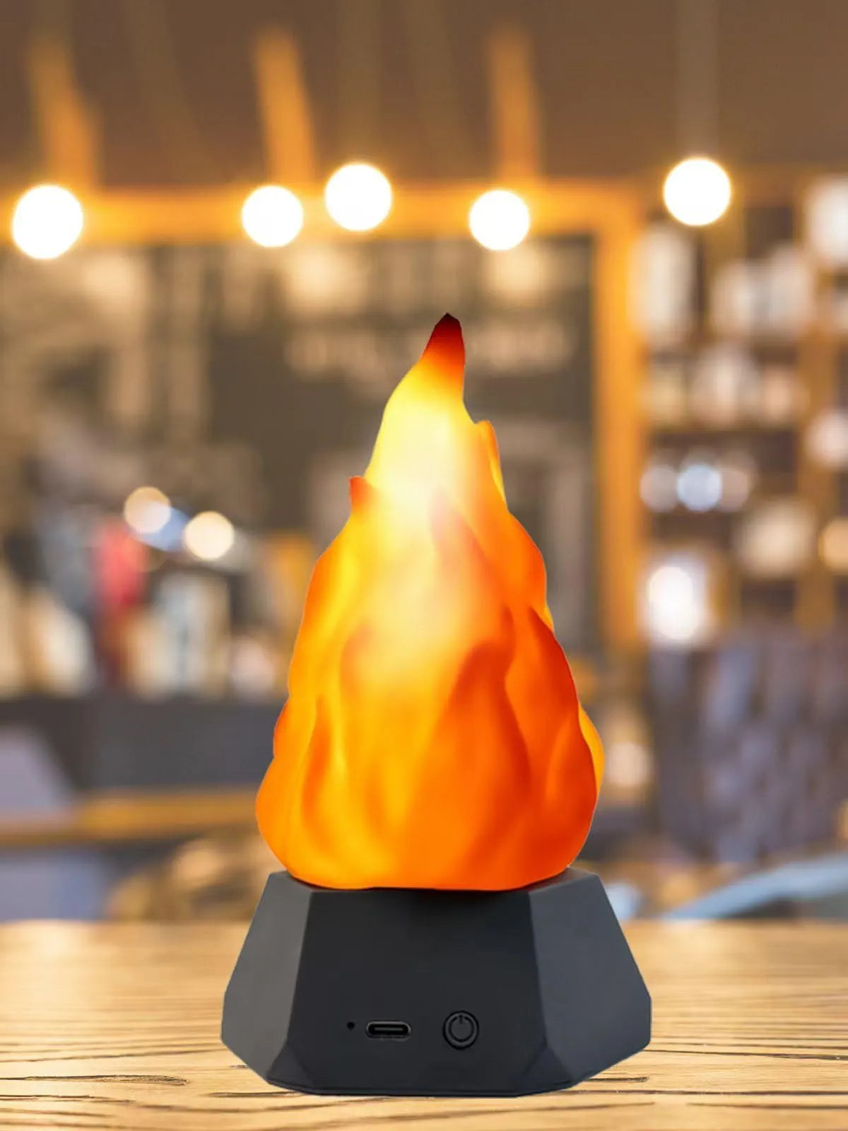 Solar-powered flame-shaped decorative light with charging base for outdoor camping and courtyard illumination