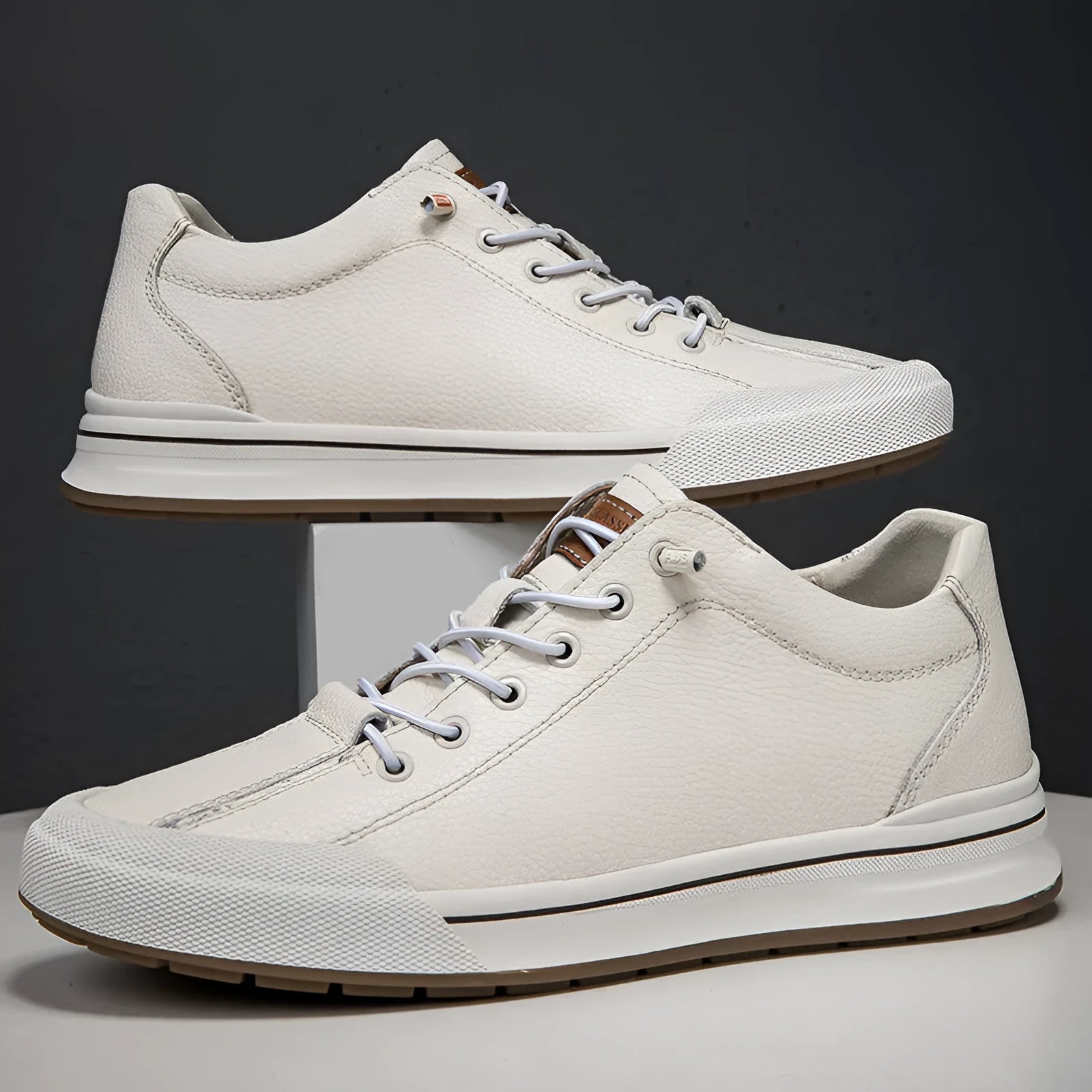 Men's white matte leather casual shoes with round toe and flat sole.