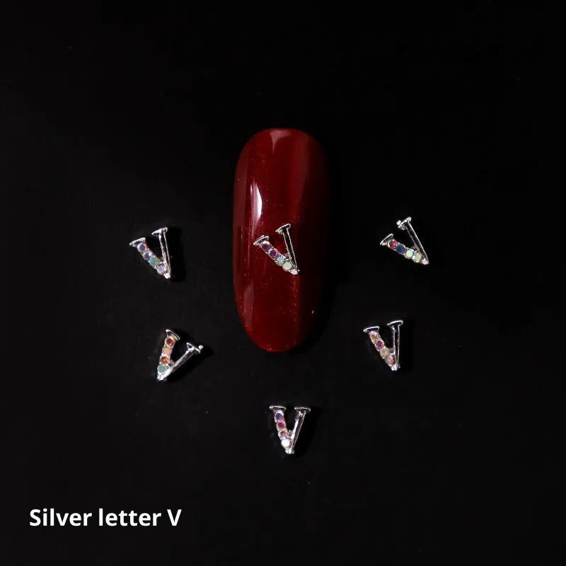 Gold alloy letter A nail ornament charm with crystal detail on a square chain base