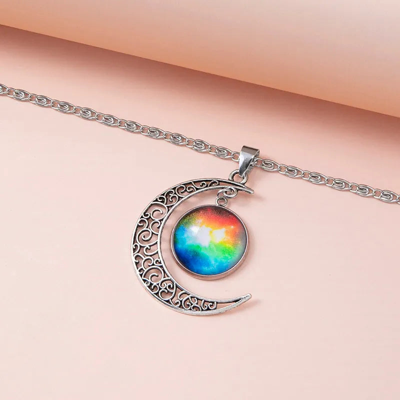 Silver hollow moon pendant necklace with glass star insert on Figaro chain for women