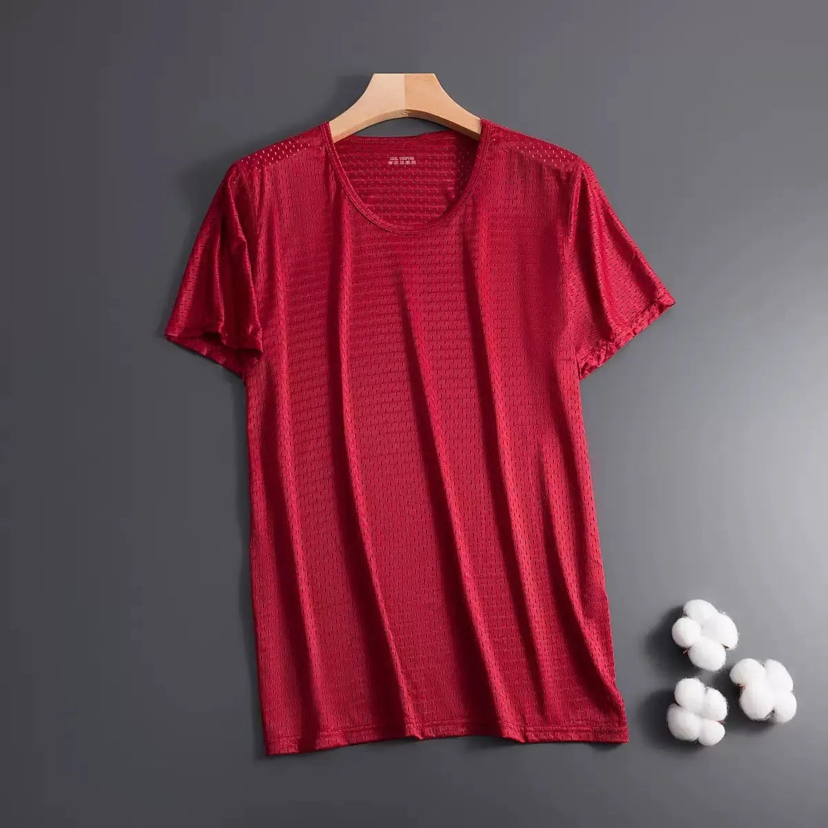 Men's solid colour Ice Silk short sleeve crew neck T-shirt in loose fit on a hanger.