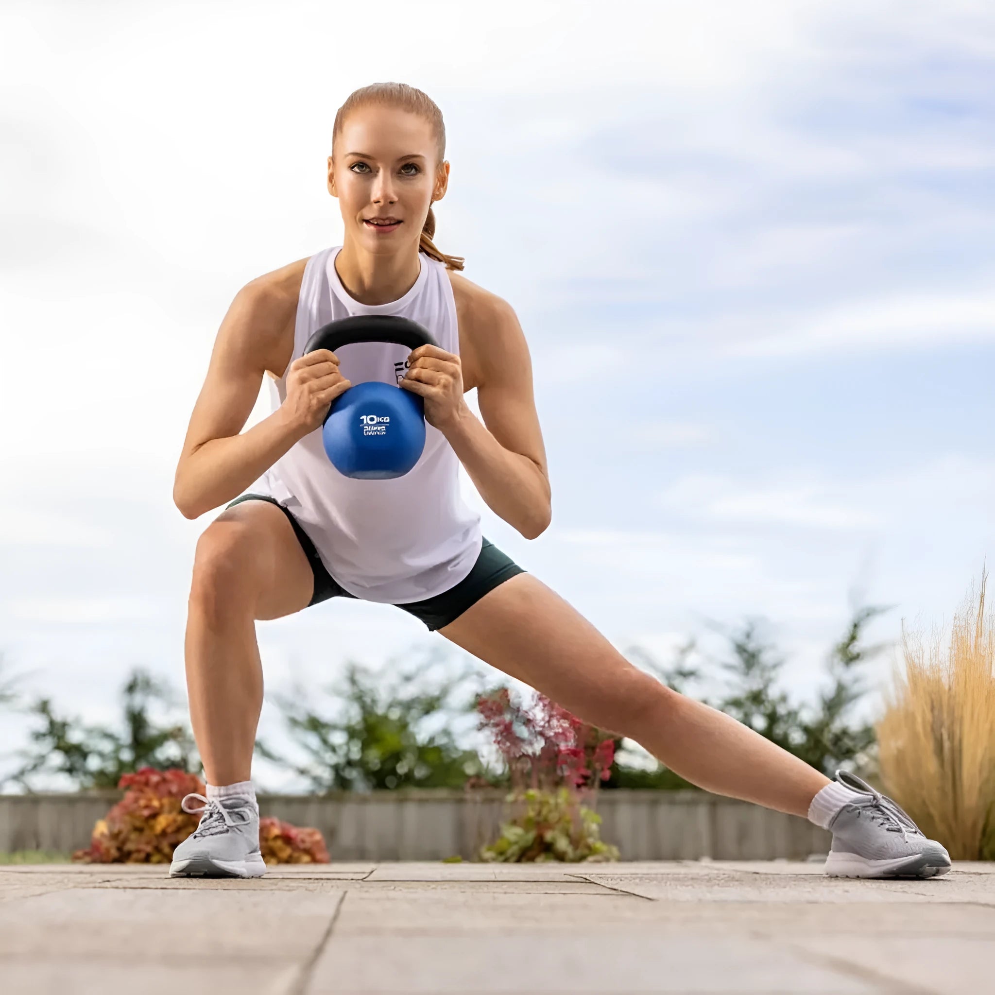 Blue cast iron teapot-shaped dumbbell with 10 kg weight marking