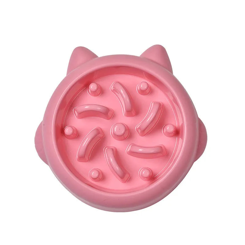 Green pet slow feeder bowl with raised bone-shaped obstacles inside to slow down eating.