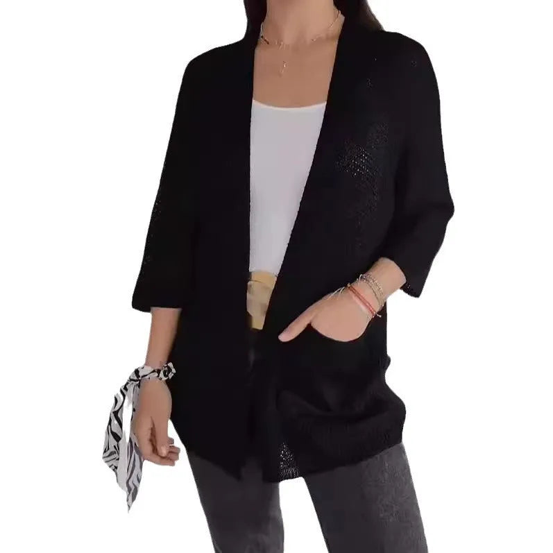 Women's army green waffle weave cardigan coat with nine-quarter length sleeves and pockets.