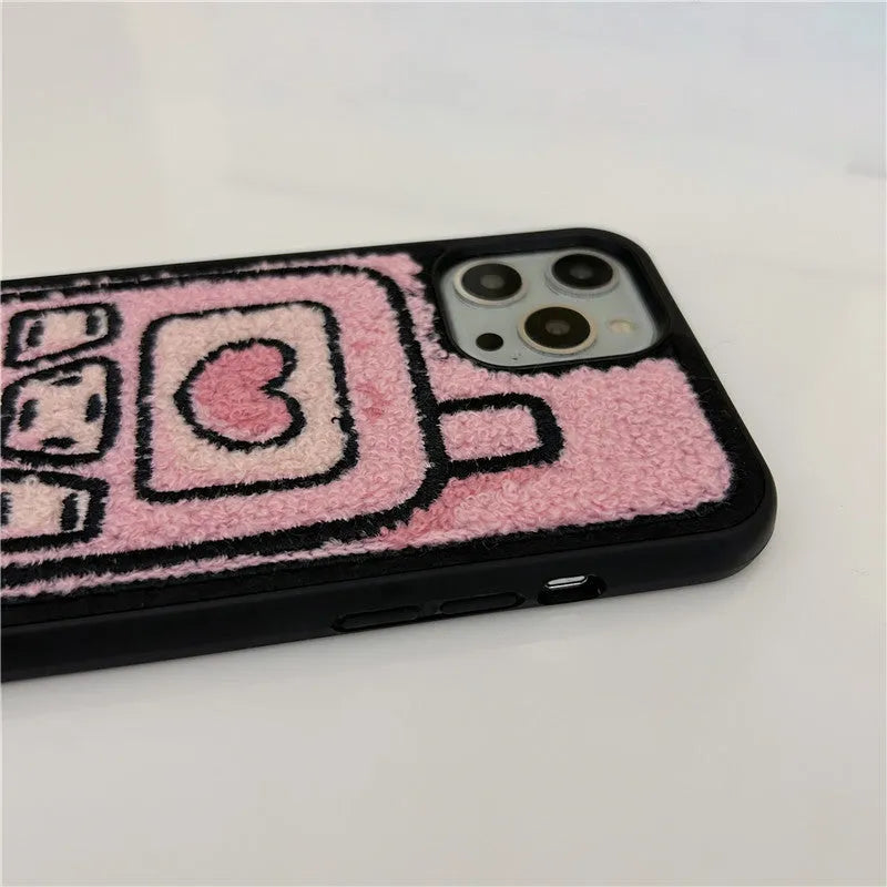 Pink towel embroidered TPU iPhone case showing textured surface on back cover.