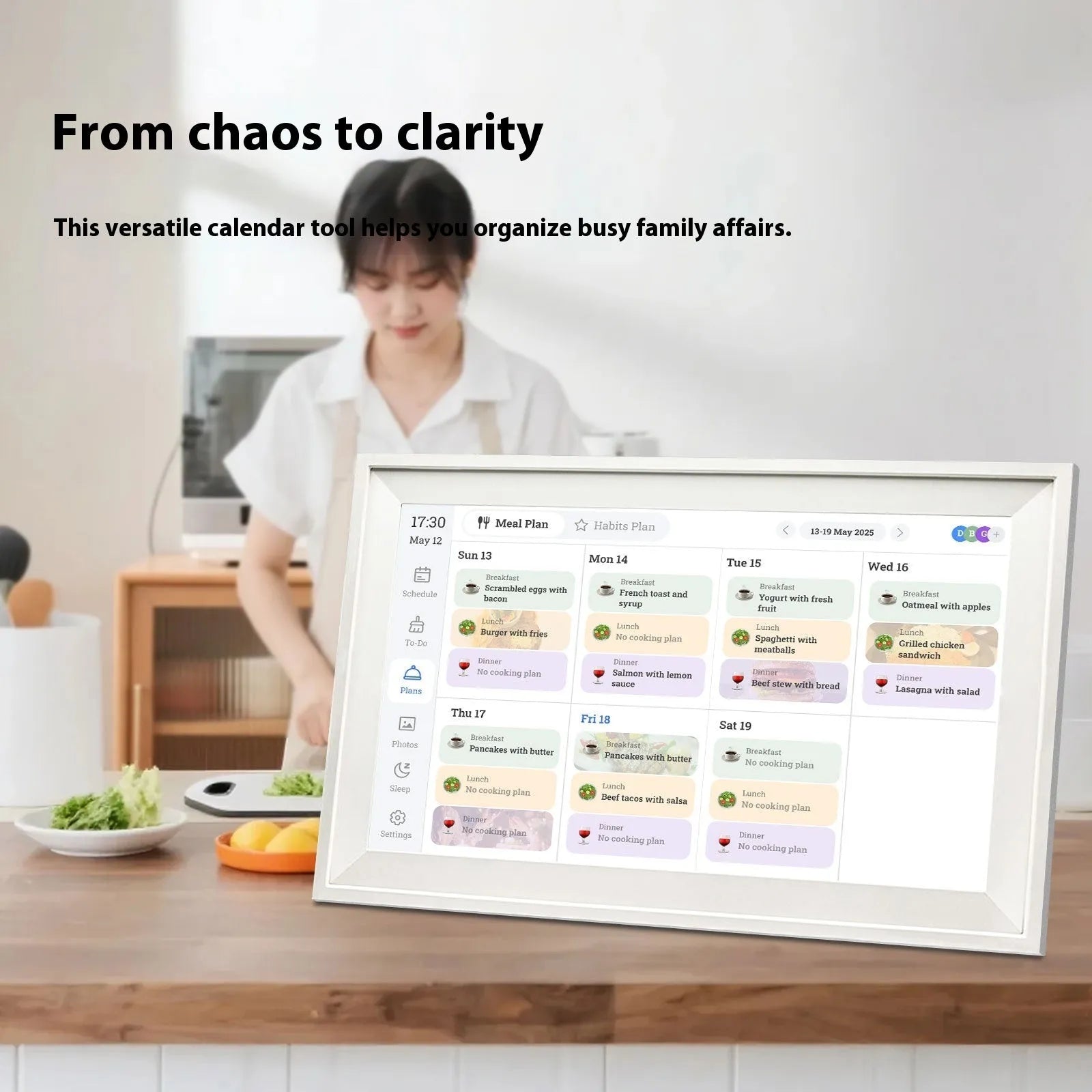 White 15.6 inch smart digital photo frame showing family photographs on HD screen