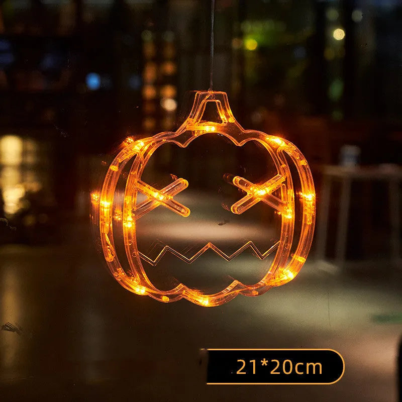 Seven Halloween LED window lights with spider, pumpkin and ghost designs on suction cups