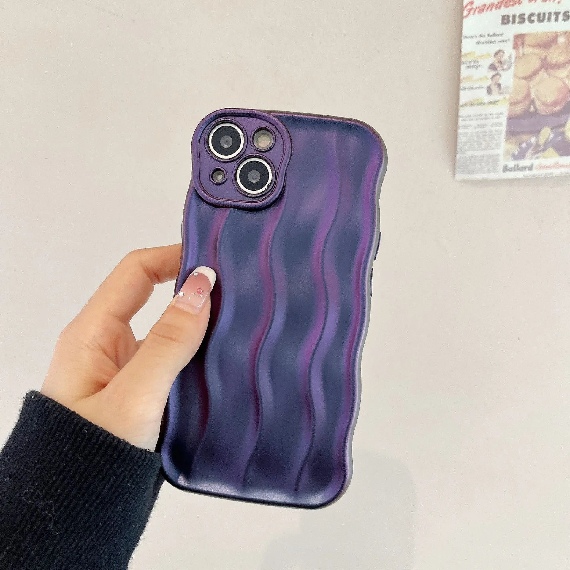 Silicone iPhone 17 phone case with water ripple texture in burgundy colour.