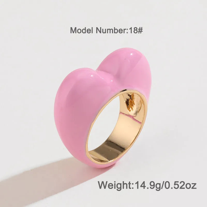 Heart-shaped three-dimensional enamel ring in zinc alloy showing raised colourful design