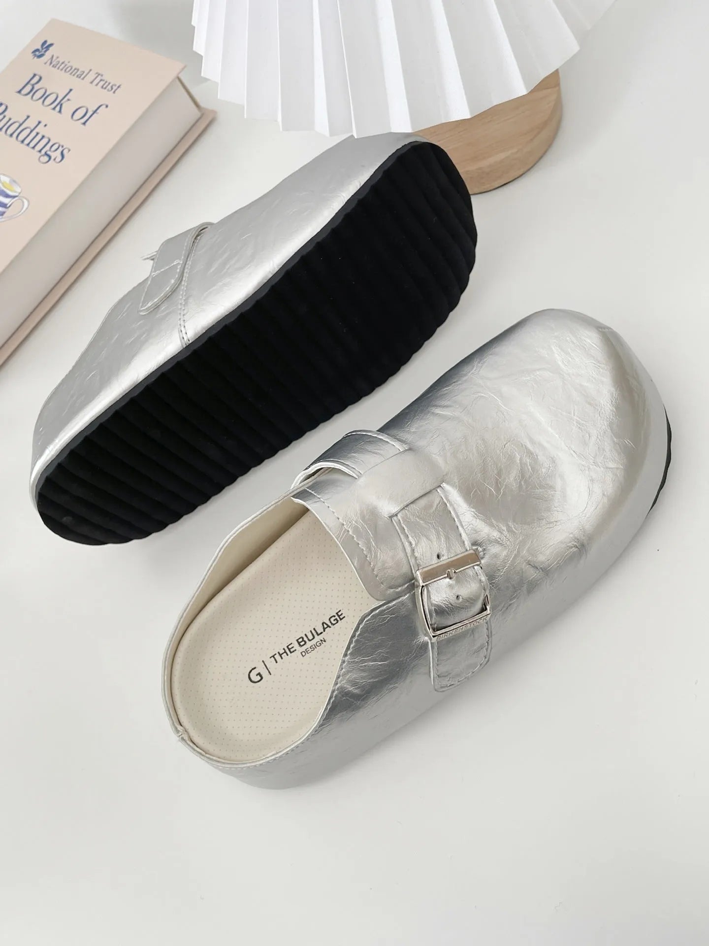 Women's flat buckle casual sneakers in yellow, creamy-white, silver, and black colours with round toe design
