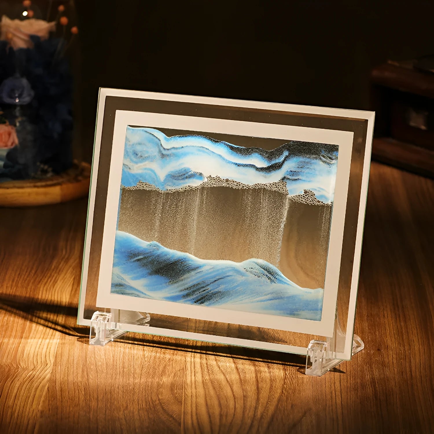 Geometric glass ornament with internal landscape quicksand painting in black, white and green colours.