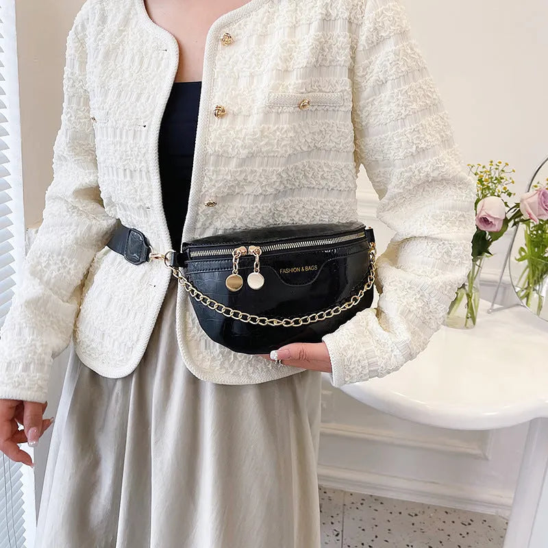 Shiny PU chest bag with chain shoulder strap available in silver colour