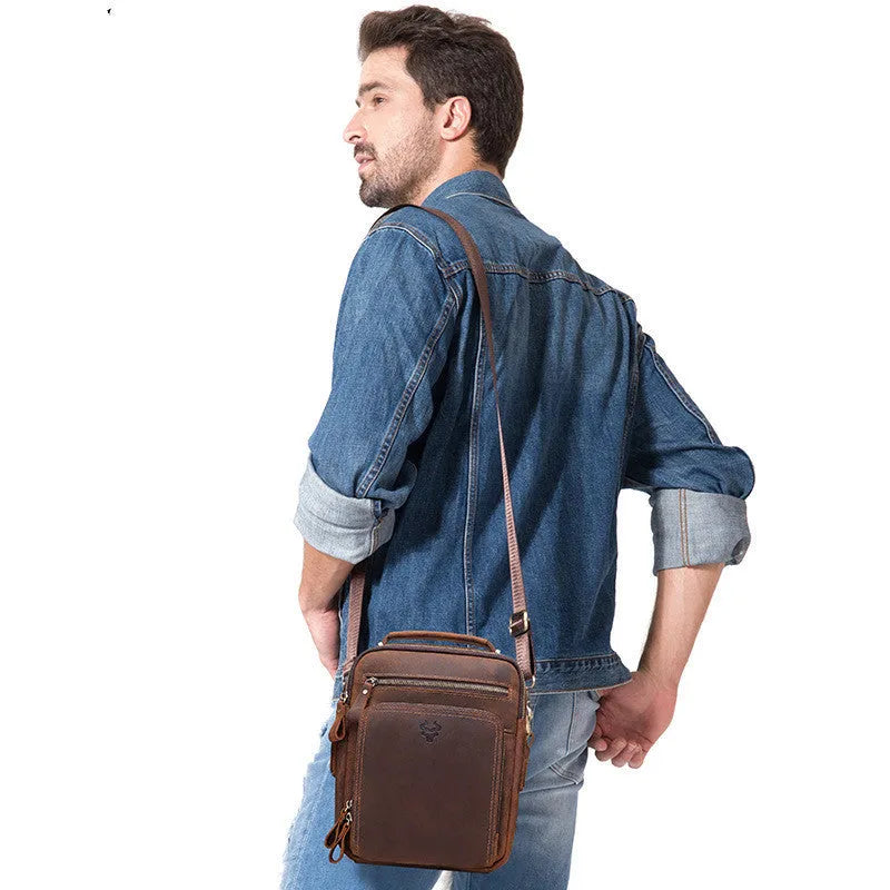 Men's brown genuine Crazy Horse leather crossbody bag with a single shoulder strap and retro sewing detail.