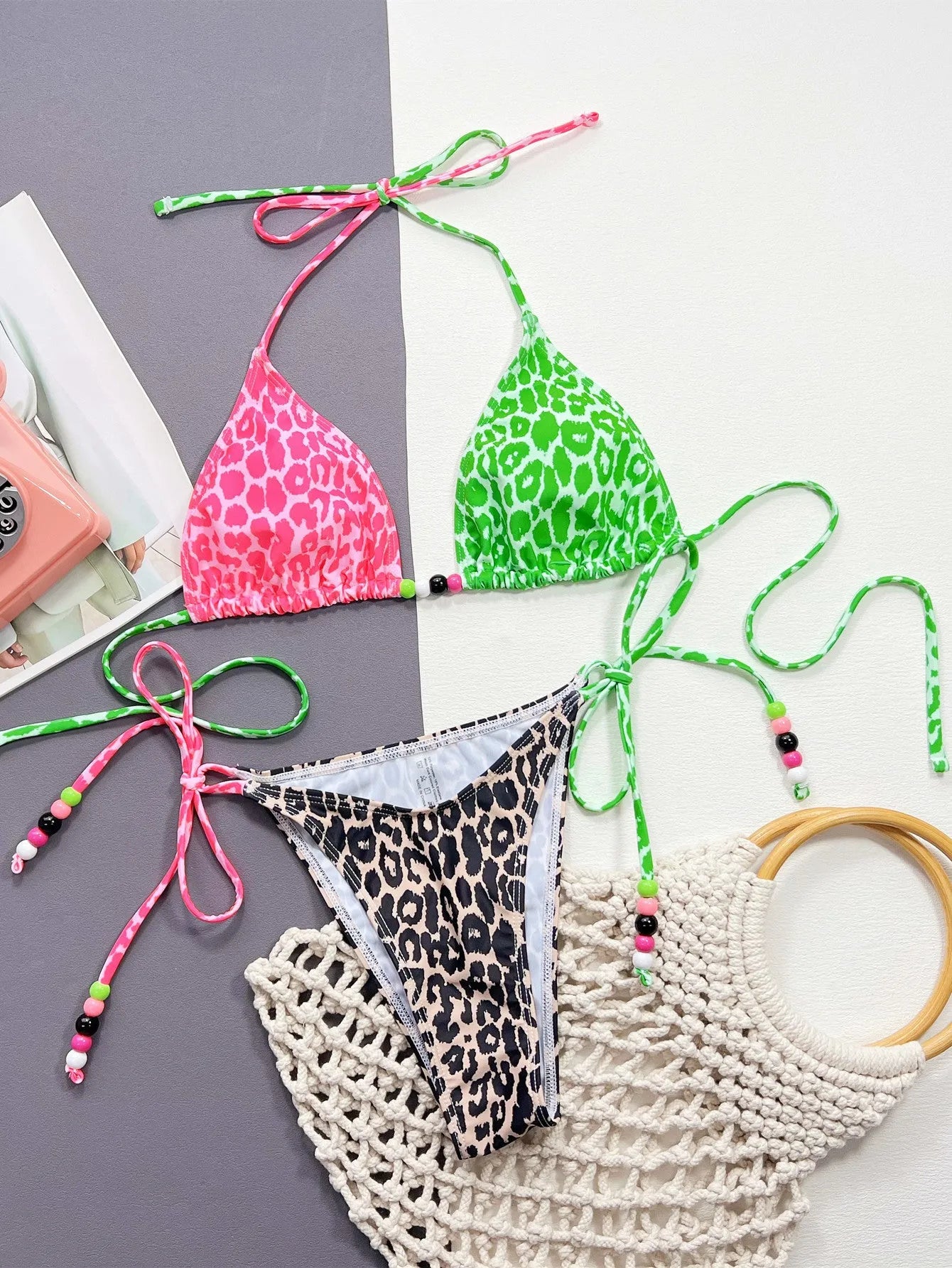 Women's leopard print bikini swimsuit with bra and briefs on white background