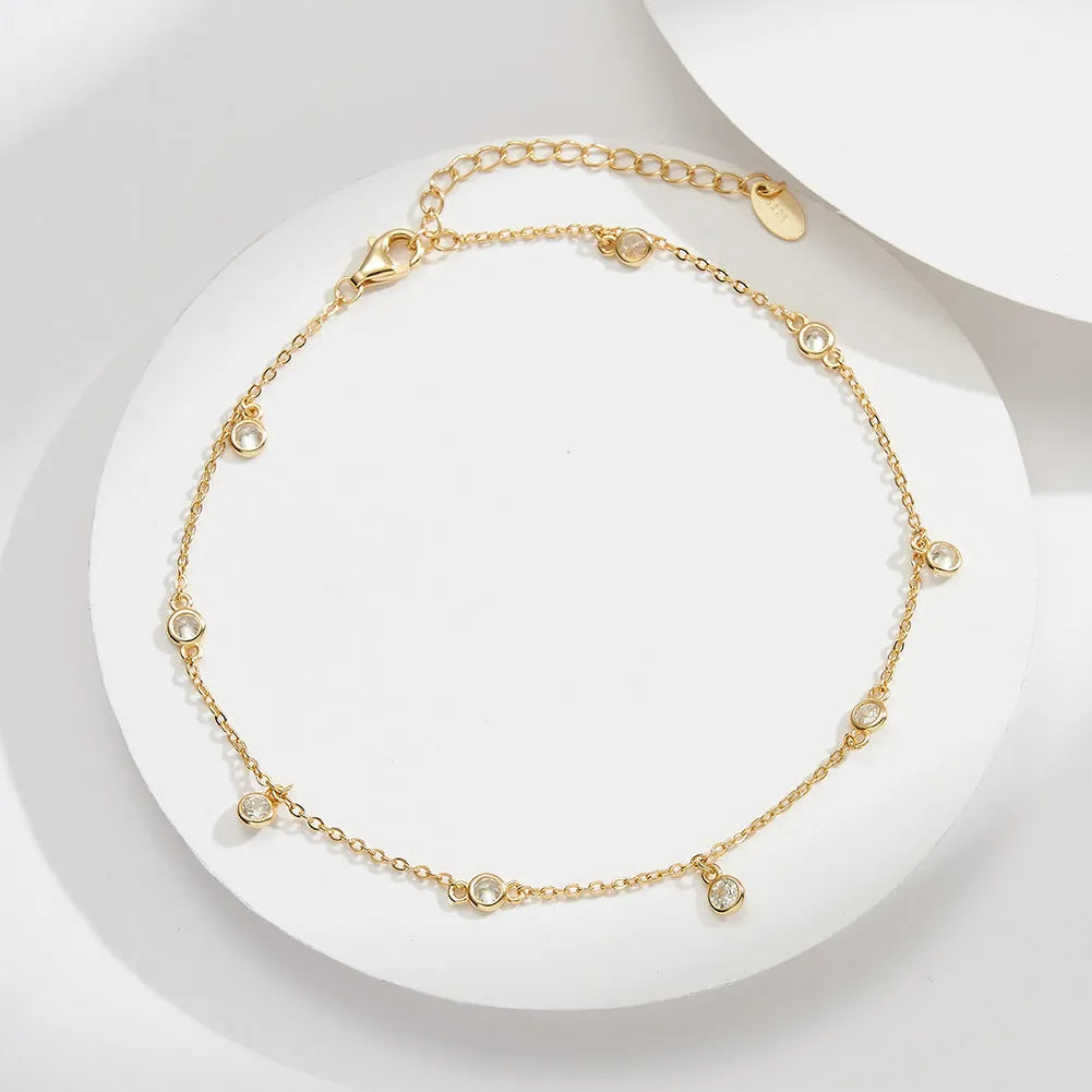 Women's silver anklet with geometric zirconium pendant in gold or white gold finish.