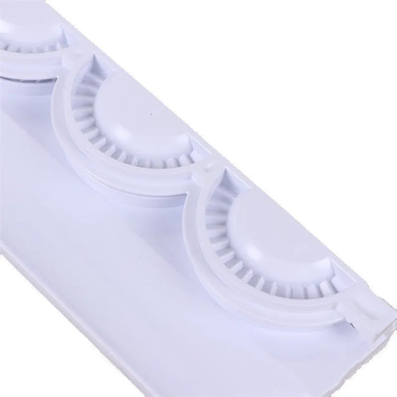Pure white ABS plastic dumpling maker on a kitchen counter, compact design, modern simple style