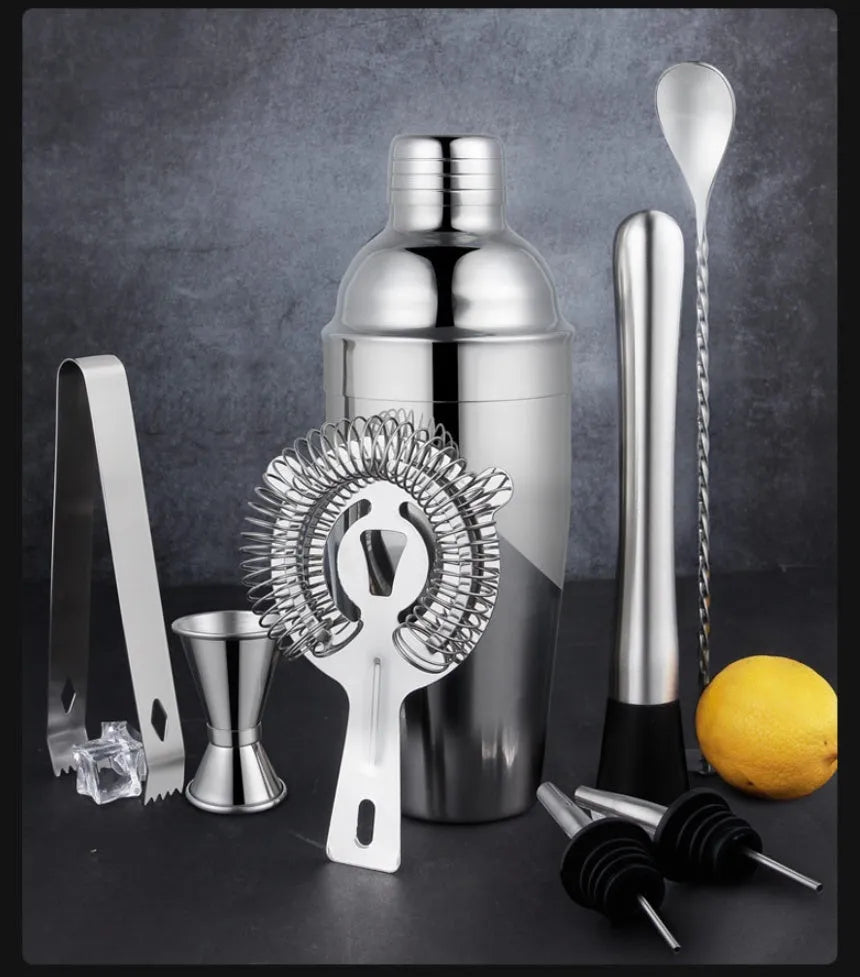 23-piece stainless steel cocktail set with shakers and bar tools on counter