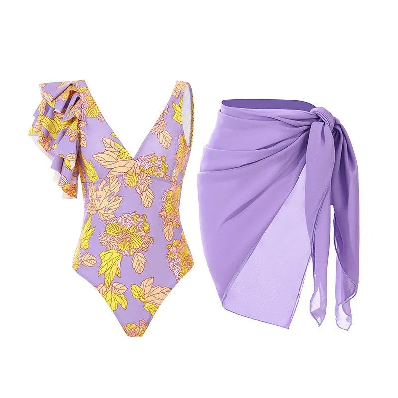 Solid colour women's one-piece swimsuit with spaghetti straps and a matching skirt.