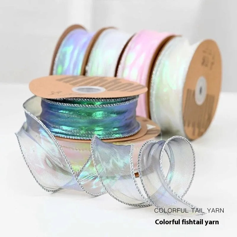 Fishtail yarn wave ribbon in various illusion colours showing 4cm width and textured mesh construction
