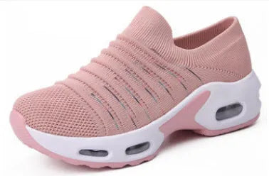Women's fly-knit stretch sock shoes in light grey with low heel and round toe.
