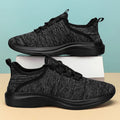 Women's low-top casual sneakers in black with flyknit mesh upper and lace-up front.