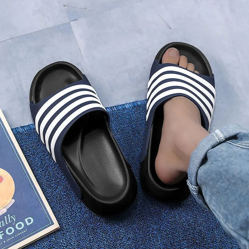 A pair of casual unisex slippers with an EVA sole and PVC upper, shown in a two-tone colour option.