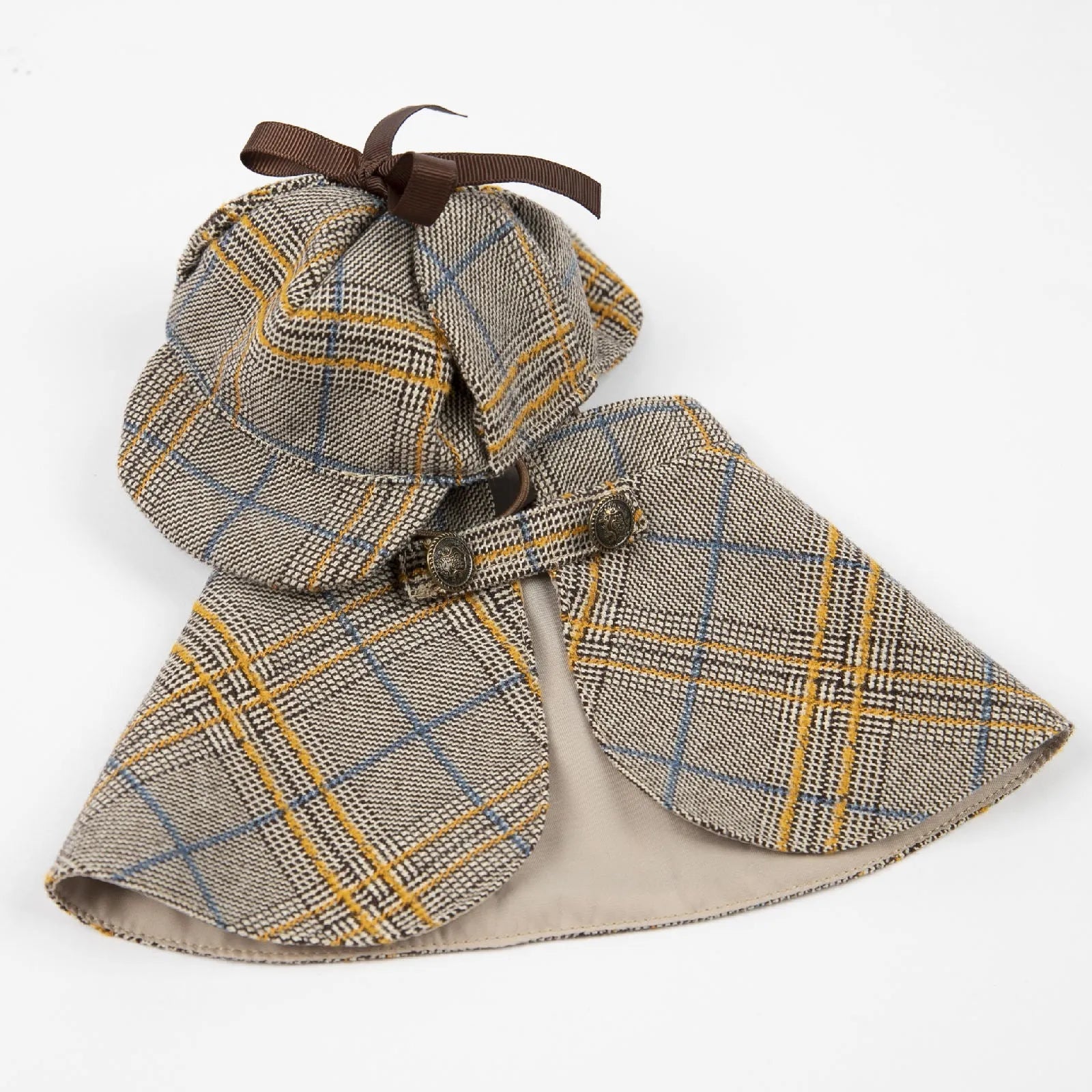 Camel-colour cotton detective cloak pet costume with adjustable hat on a small dog