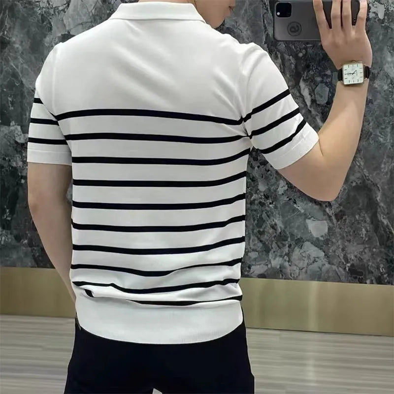 Black and white striped pullover T-shirt with a lapel-style neckline laid flat.