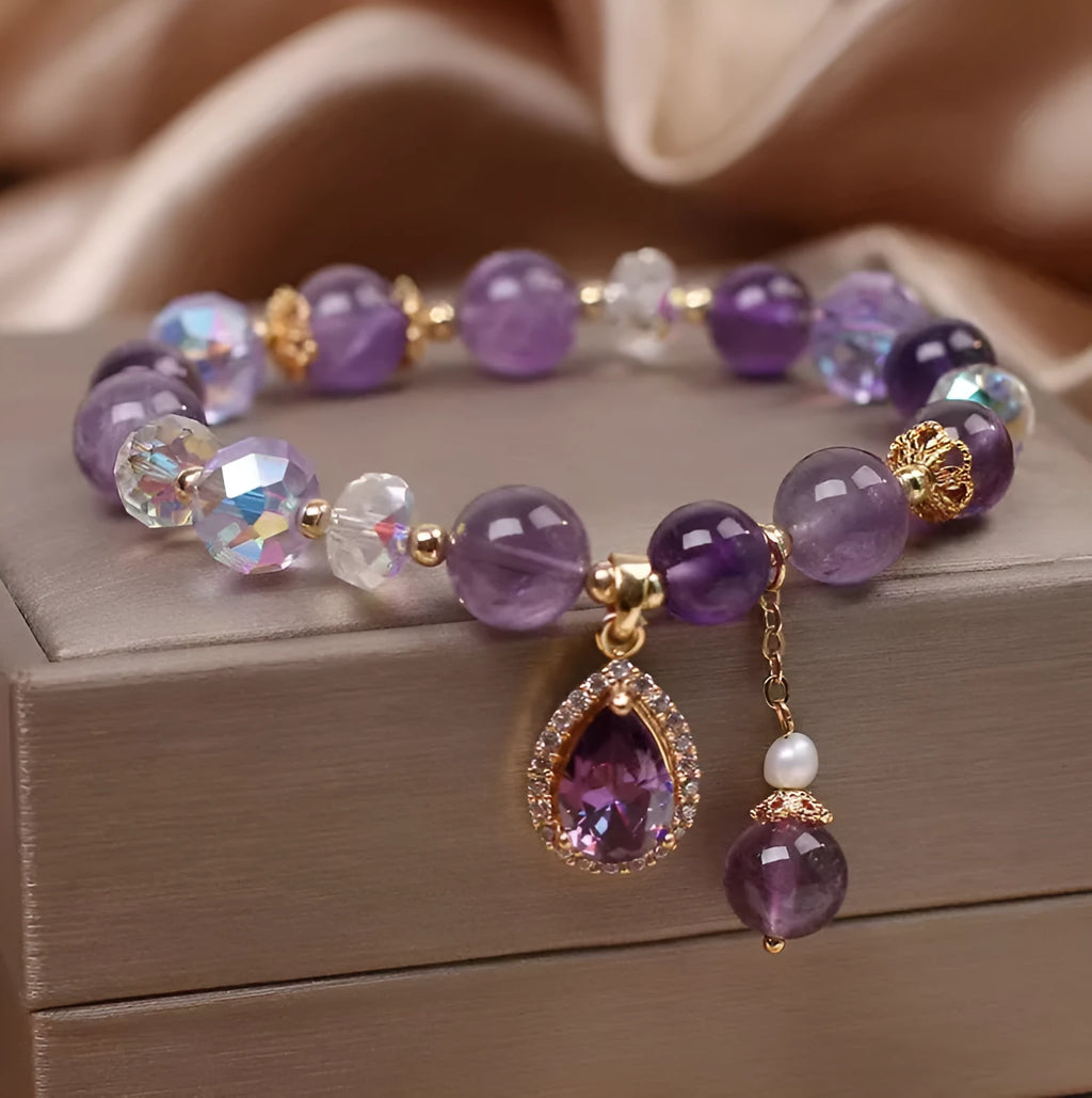 Close-up of a women's purple amethyst crystal bracelet with micro inlay detailing.