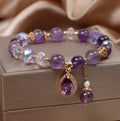 Close-up of a women's purple amethyst crystal bracelet with micro inlay detailing.