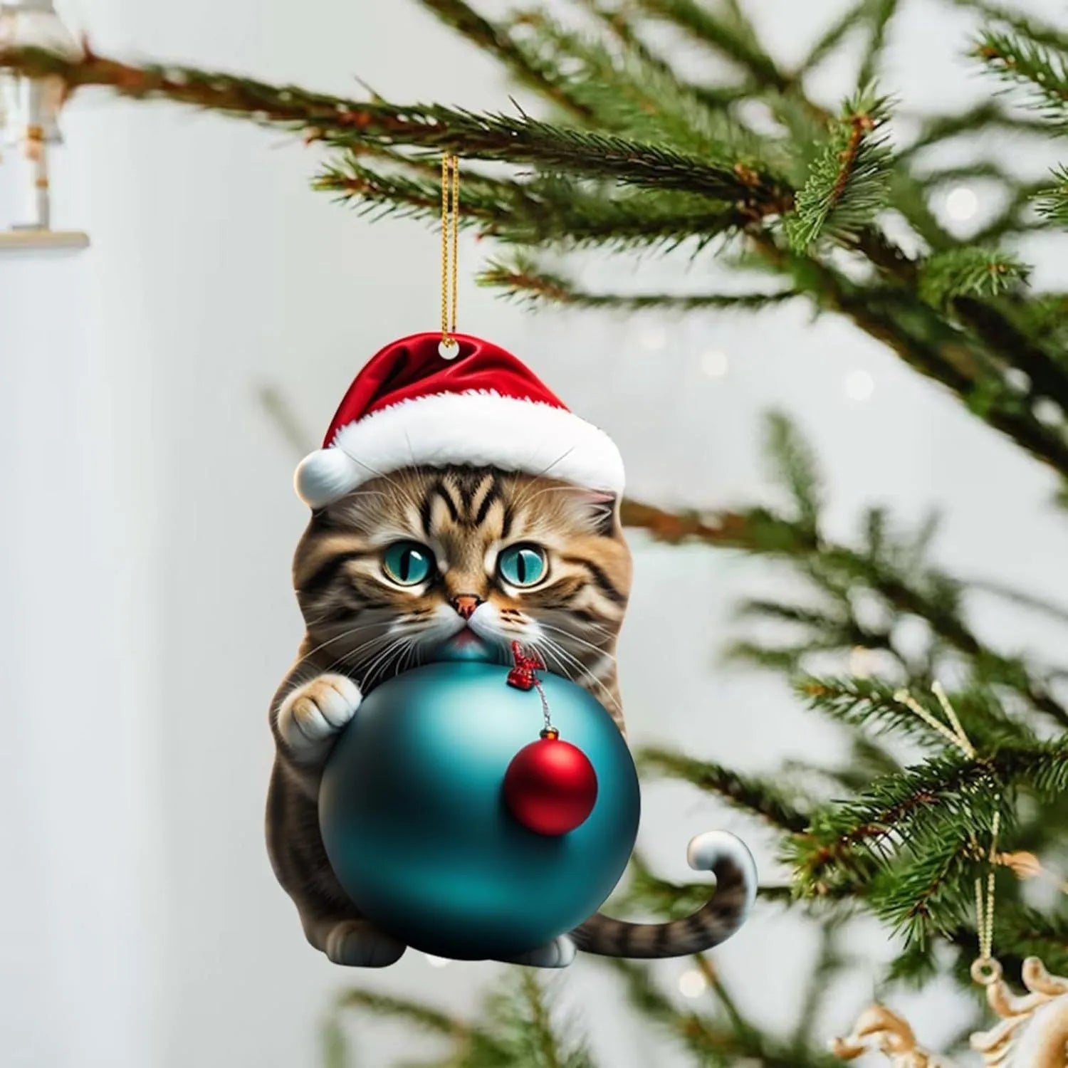 Colourful cartoon-style kitty cat Christmas ornament hanging, made from clear acrylic for car interiors.