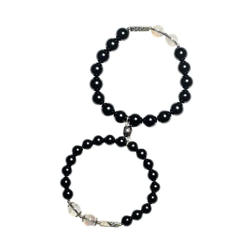 Obsidian couple bracelet DIY set with 8mm and 10mm Buddha beads on adjustable string.