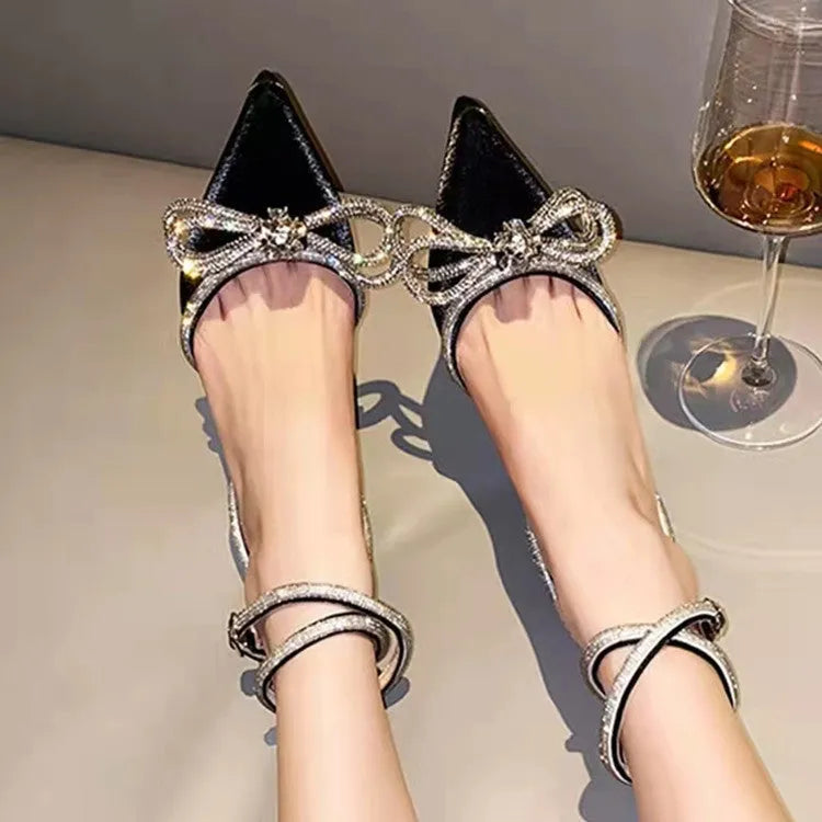 Women's black stiletto heel sandals with silk bandage detail on back and buckle fastening.