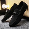 Men's black waterproof PU slip-on loafers with a round toe and low stiletto heel on a rubber sole.