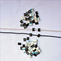 Black nylon PA66 automotive cable management clips measuring 9mm x 12mm x 6.2mm