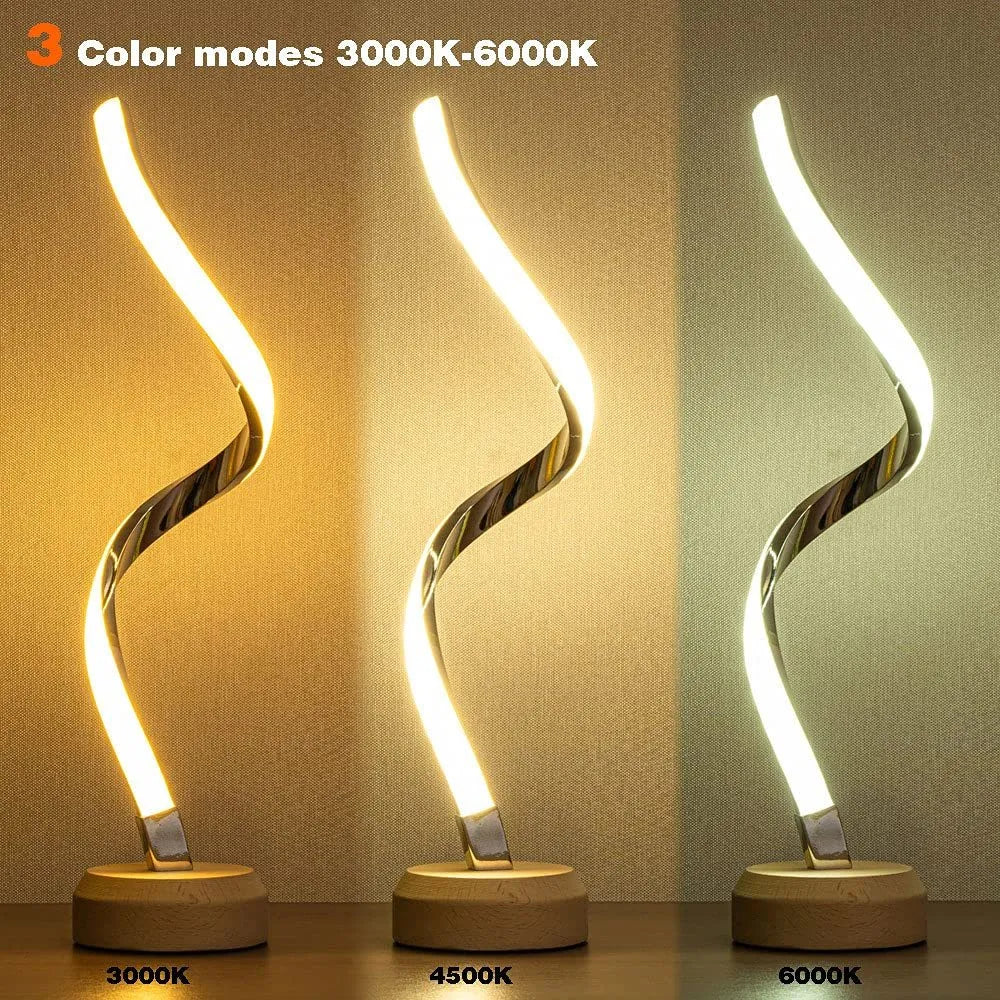 LED spiral table lamp with wooden curved base and USB cable, glowing warm white light