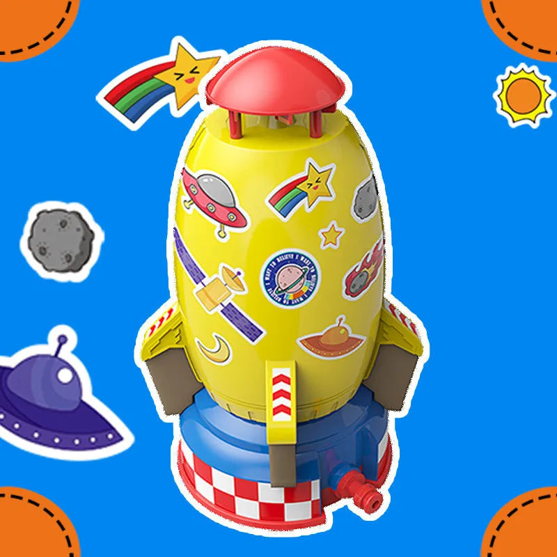 Water pressure rocket launcher toy on green grass with water spray, yellow rocket, and base connector