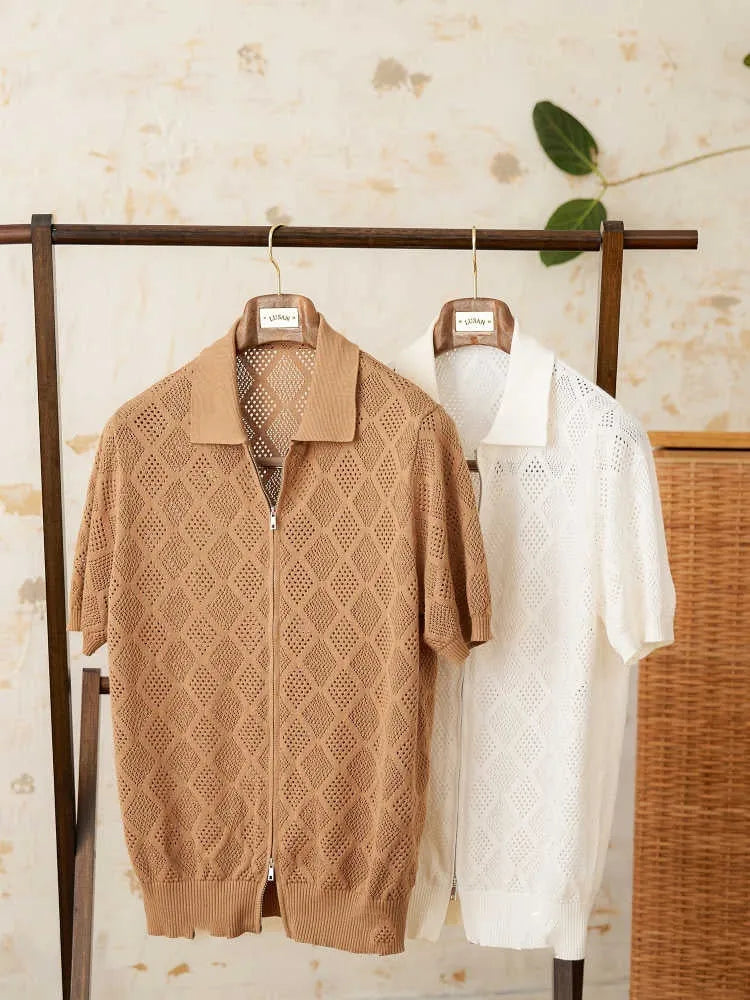 Light brown cotton short sleeve cardigan with zip front and lapel collar on a hanger