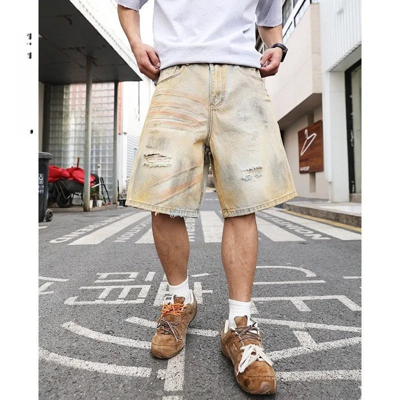 Light blue men's denim shorts with ripped details and a straight-leg cut on a mid-rise waist.