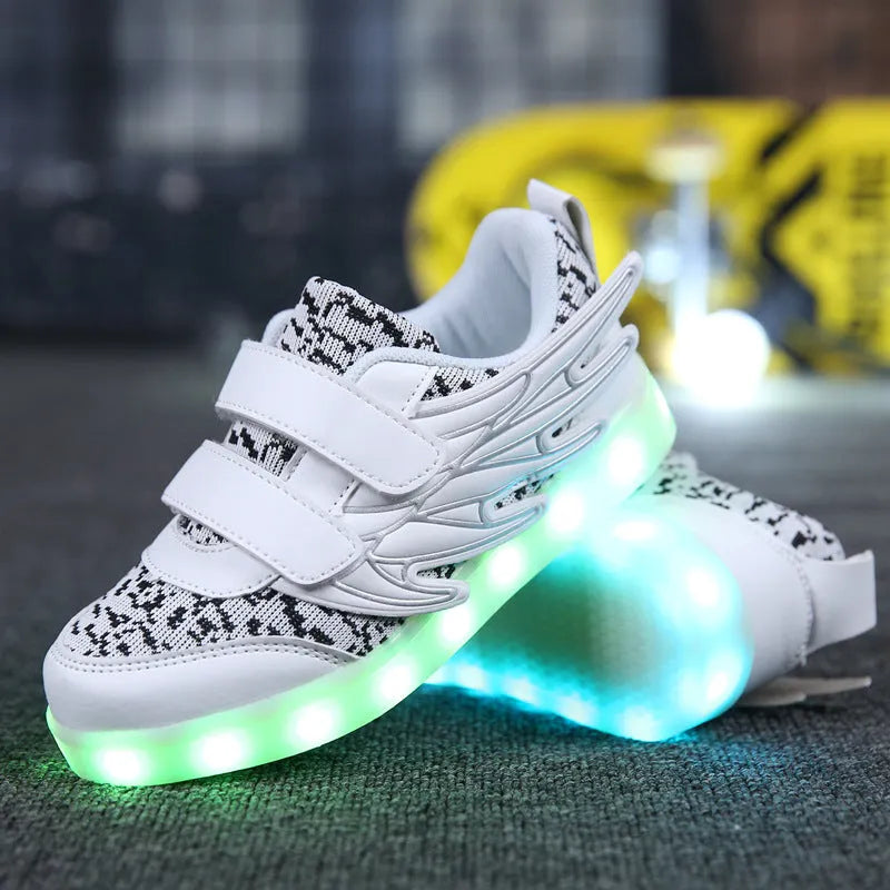 Children's plum red and white LED light-up sneakers with USB charging port visible