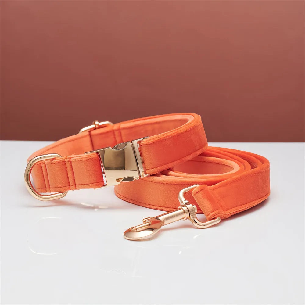 Wool striped dog collar and leash set in coral orange with anti-lost engraving on white background