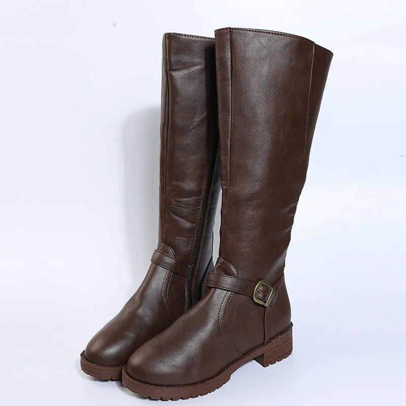Women's yellow knight high boots with buckle details on shaft and a square heel.