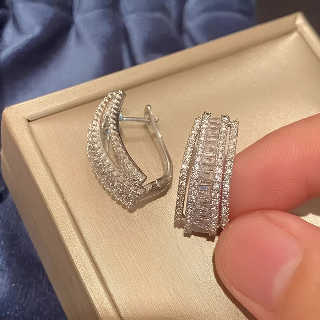 Geometric stud earrings with inlaid zircon stones in white gold colour